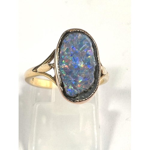 609 - An 18ct gold oval shaped black opal (14mm x 9mm) doublet ring, 3.37gms, ring size K/L.