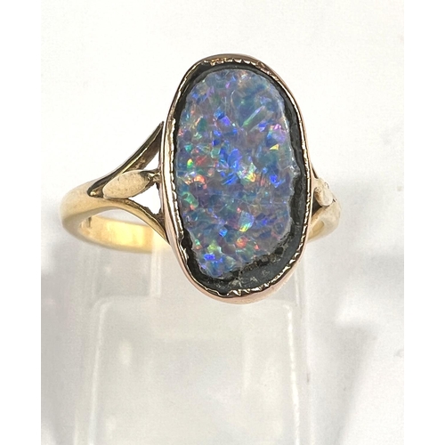 609 - An 18ct gold oval shaped black opal (14mm x 9mm) doublet ring, 3.37gms, ring size K/L.