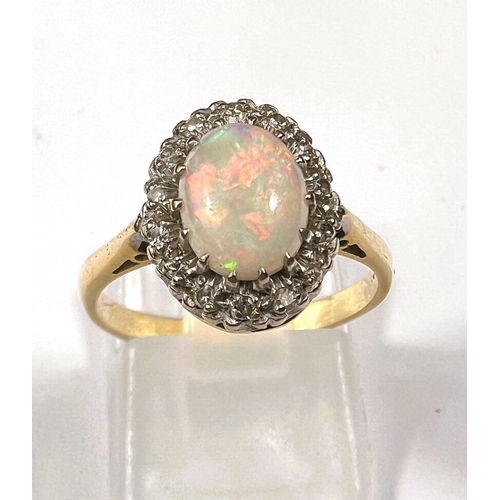 610 - Gold, hallmark worn ring with opal (good quality) 9mm x 7mm, surrounded by 16 diamonds, 3.8gms, ring... 