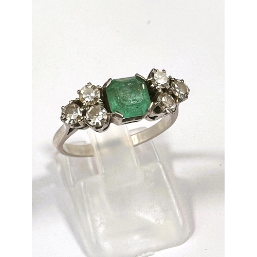 611 - A platinum stamped Art Deco dress ring, square cut emerald approximately 6mm x 6mm with bevelled and... 