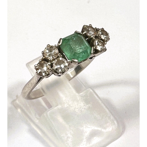 611 - A platinum stamped Art Deco dress ring, square cut emerald approximately 6mm x 6mm with bevelled and... 