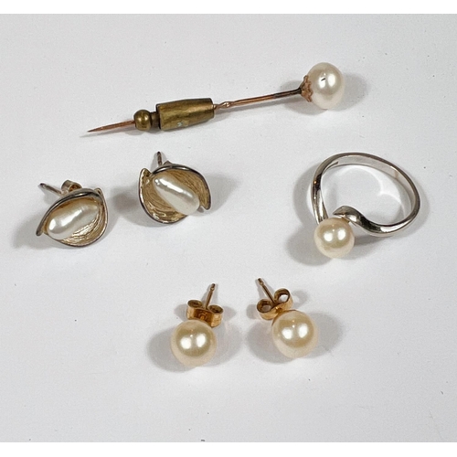 655 - An 18 carat white gold pearl ring 3.10gm, a pearl stick pin and two sets of Pearl earrings