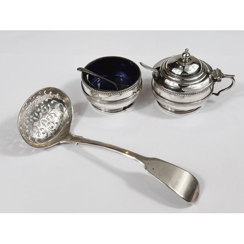 636 - A hallmarked silver sieving ladle and two cruet pots, various assay 4.8oz