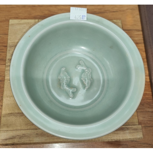 425B - A Chinese Celadon fish bowl with embossed fish to bottom diameter 14 cm, A Chinese put in box with s... 