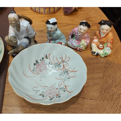 426B - A selection of 20th century Chinese ceramic figures and a similar bowl