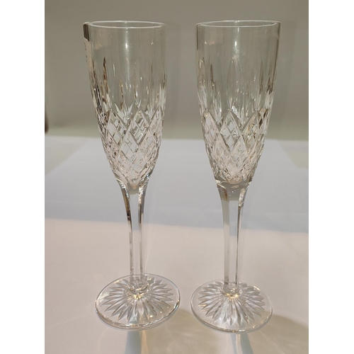 474 - A set of 8 Stuart Crystal champagne flutes plus 2 others