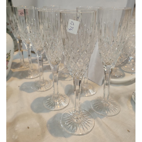 474 - A set of 8 Stuart Crystal champagne flutes plus 2 others