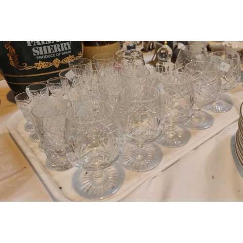 476 - A cut glass water jug, 6 brandy glasses and a selection of cut shot and liqueur glasses 