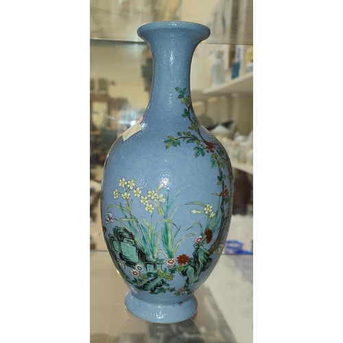 514 - A Chinese border blue Chinese vase with polychrome decoration, scrolling incised detail, four charac... 