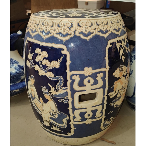 514A - A Chinese ceramic stool decorated with musical panels etc. height 42cm.