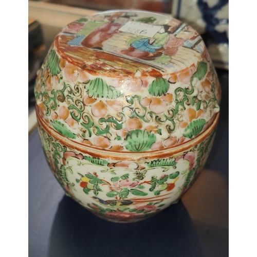 528B - A Chinese Canton barrel shaped lidded pot with domestic decoration, ht. 10.5cm