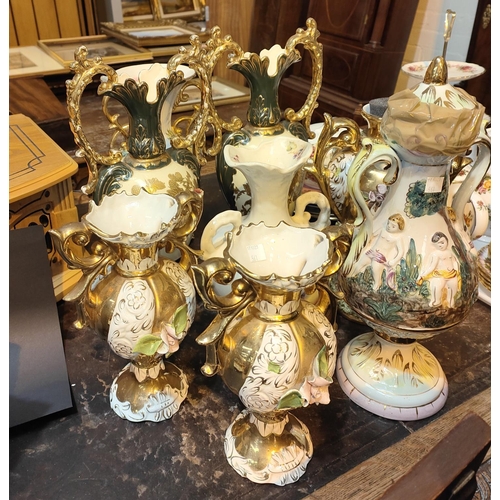 561 - Two pairs of ornate vases in the Capodimonte style; 4 similar pieces