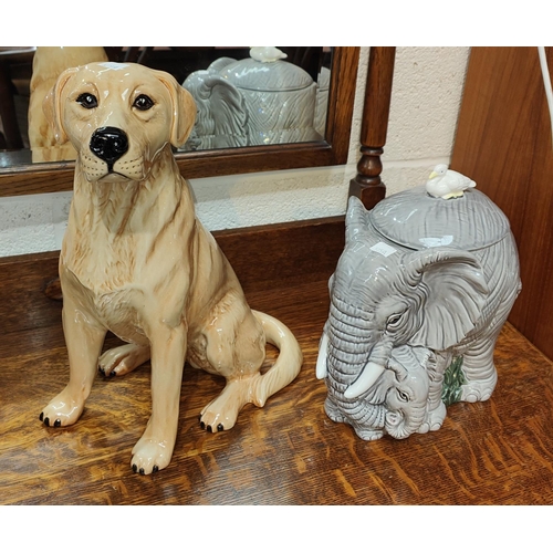 575A - A Beswick figure of a fire side labrador with a golden coat, No. 2314, Height 34cm and an elephant b... 