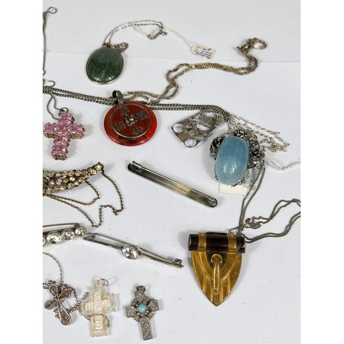 740 - Vintage costume jewellery including a hallmarked silver pierced pendant, an openwork cross, a silver... 