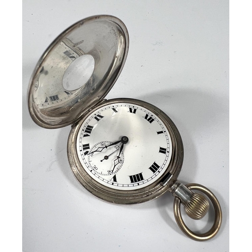 765A - A silver half hunter pocket watch with blue enamel Roman numerals to the outside