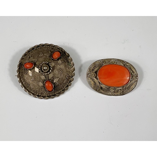 766B - A two white metal and coral brooches 