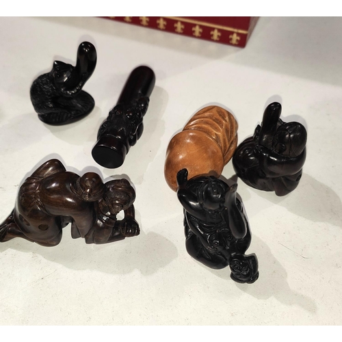 131D - A selection of carved wooden netsuke.