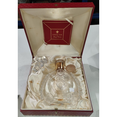 131F - A Louis XIII Remy Martin bottle, cased in a red presentation case (empty).