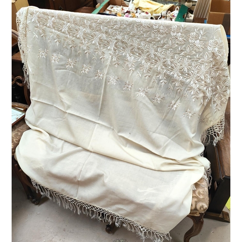 72A - A cream  embroidered shawl with plaited fringing.