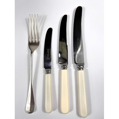 650A - A hallmarked silver canteen of rat tail cutlery, 12 settings, and 3 piece carving set, the knives wi... 