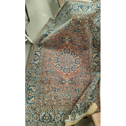 838 - A hand knotted Isfahan style rug with red ground  with blue highlights, width 147cm