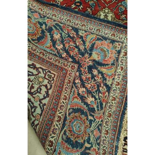 839 - A hand knotted Isfahan style rug with blue ground red highlights width 133cm