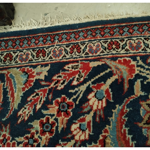 839 - A hand knotted Isfahan style rug with blue ground red highlights width 133cm