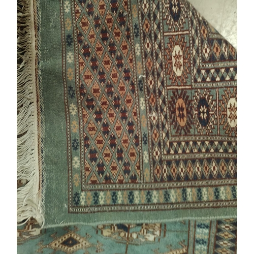 842 - A green ground hand knotted Middle Eastern rug 183cm x 130cm and a other similar rugs etc.