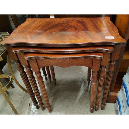 855 - A nest of three reproduction inlaid mahogany occasional tables shaped rectangular form, reeded legs