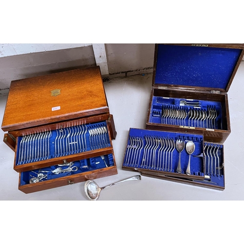 633 - A large oak canteen of silver plated cutlery, hinged lid and two drawers below; a smaller similar