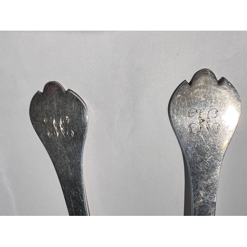 651A - A hallmarked silver pair of tablespoons with trefoil terminals, monogrammed, London 1898, 4oz; a pie... 