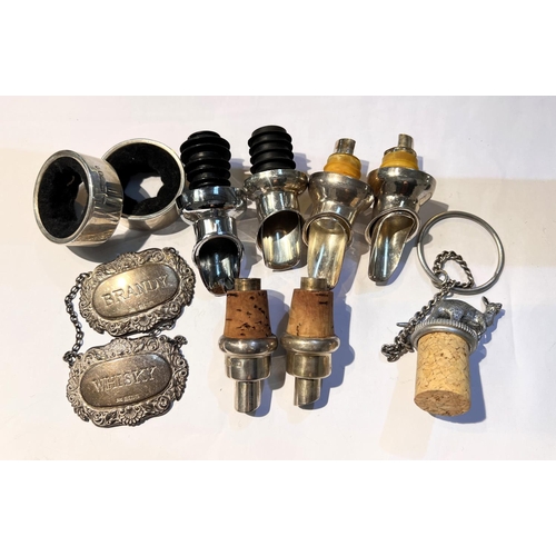 652 - A selection of silver bottle pourers, two silver napkin rings etc