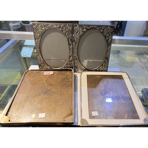 745 - A pair of hallmarked silver photo frames and a silver plated photo frame