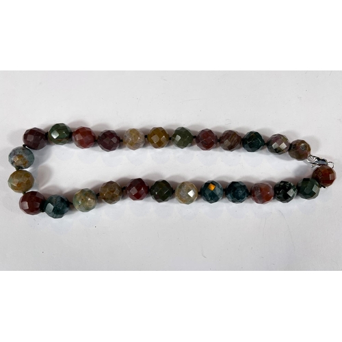 762 - A faceted bead Zoisite and Ruby necklace with white metal clasp