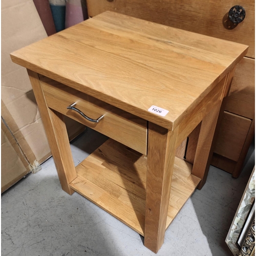 1026 - A light oak bedside table with single drawer and shelf under