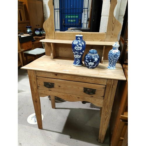 1027 - A stripped pine dressing table with single drawer and copper handles