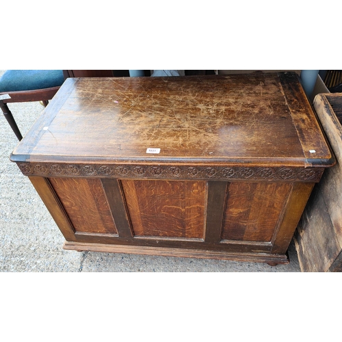 1031 - A 1930's panelled oak blanket box.