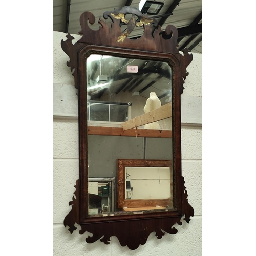 1035 - A Chippendale style wall mirror in parcel gilt & fretwork frame.