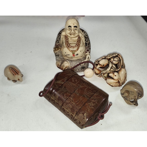 131E - A selection of resin and other carved items.