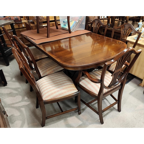 867 - A good quality mahogany Rackstraw extending 8/10 seater pedestal mahogany dining table and 8 (6 plus... 