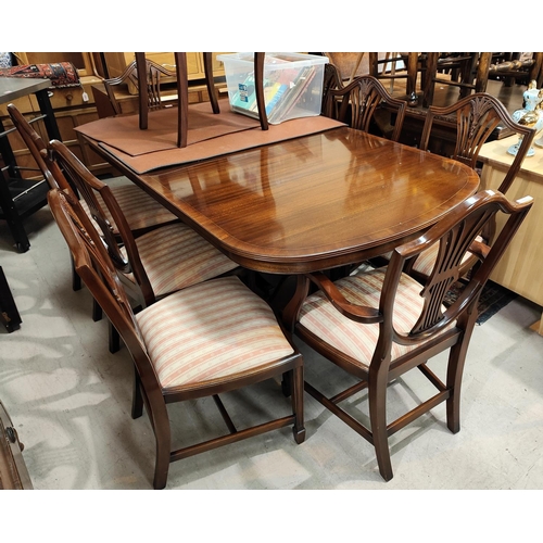 867 - A good quality mahogany Rackstraw extending 8/10 seater pedestal mahogany dining table and 8 (6 plus... 