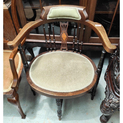 969 - A mahogany inlaid tub shaped armchair with shell decoration and three similar inlaid chairs