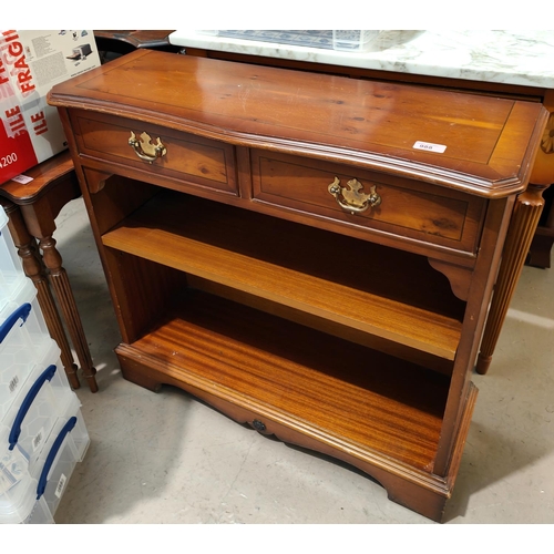 988 - A reproduction bookcase with two drawers and shelves below, a similar reproduction cupboard with two... 