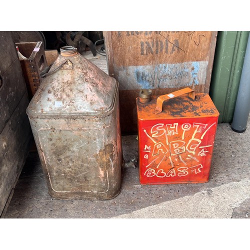 100C - Two large vintages oil cans