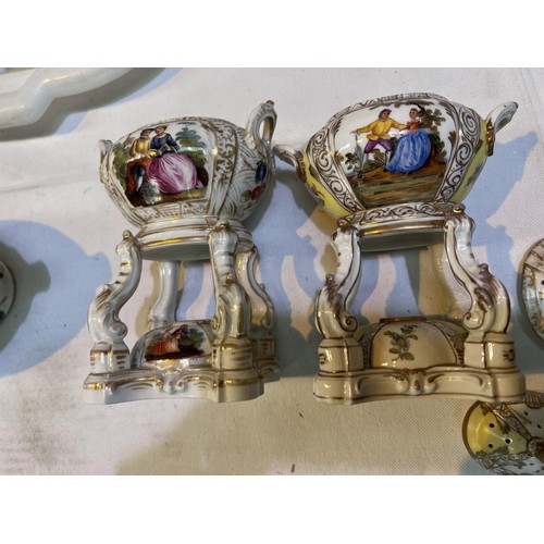 458 - Two Meissen miniature ceramic tea burners with decorated panels, gilt highlights and a similar lidde... 