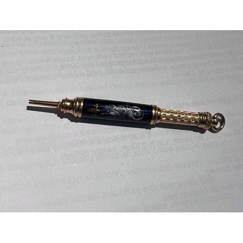 640 - A 19th century propelling pencil in gilt and deep blue enamel with classical decoration of a female ... 