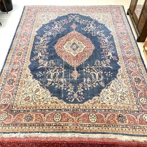 880 - An old Turkey carpet, worn, 380 x 290cm