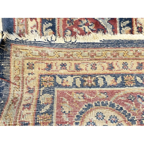 880 - An old Turkey carpet, worn, 380 x 290cm