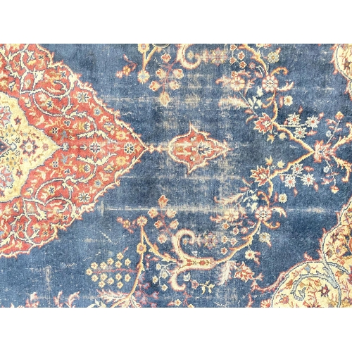 880 - An old Turkey carpet, worn, 380 x 290cm