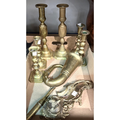17 - A selection of 19th century brass candlesticks; a reproduction brass oil lamp; etc.